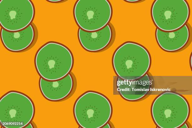 kiwi fruit on orange table - breakfast with view stock illustrations