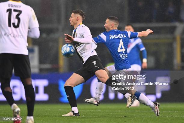 Adrian Benedyczak fight for the possession during Serie B match between Parma and Brescia at Stadio Ennio Tardini on March 08, 2024 in Parma, Italy.