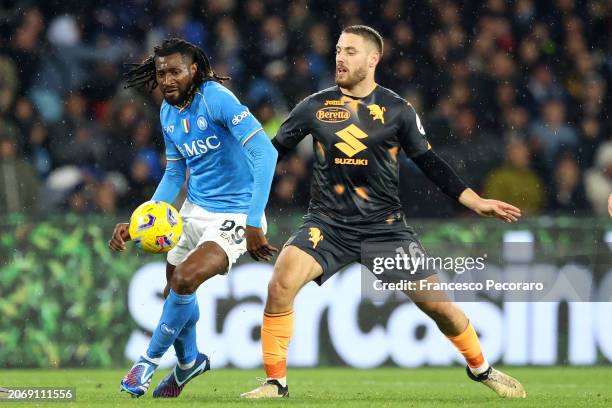 Frank Anguissa of SSC Napoli battles for possession with Nikola Vlasic of Torino FC during the Serie A TIM match between SSC Napoli and Torino FC -...