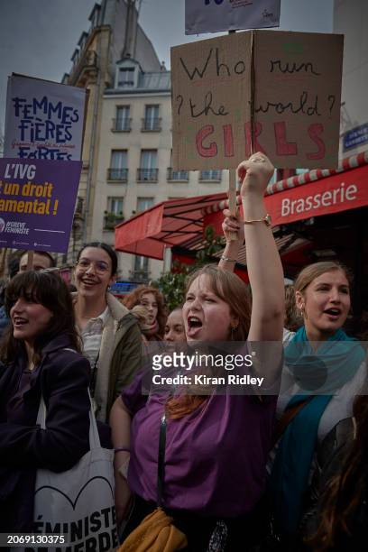 Protesters chant as they march through central Paris to mark International Women’s day to raise awareness for women’s rights and call for greater...