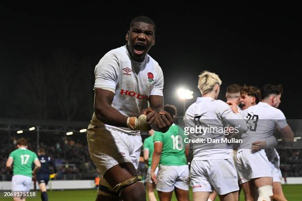 Junior Kpoku of England celebrates after teammate Ben Waghorn of England scored their team's third try during the U20 Six Nations match between...