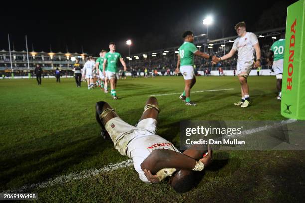 Junior Kpoku of England lies dejected after his team's draw in the U20 Six Nations match between England and Ireland at The Recreation Ground on...