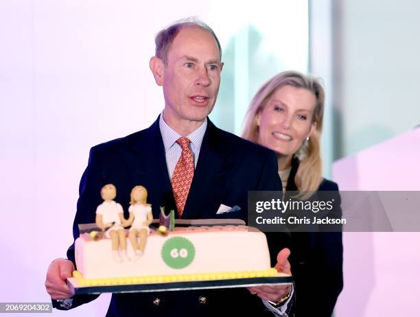Prince Edward, Duke of Edinburgh and Sophie, Duchess of Edinburgh's smile as Prince Edward's about to cut his 60th Birthday cake, during the...