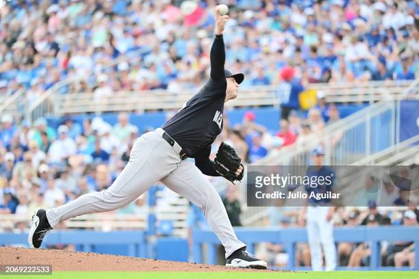 Clay Holmes of the New York Yankees delivers a pitch to the Toronto Blue Jays in the fifth inning during a 2024 Grapefruit League Spring Training...