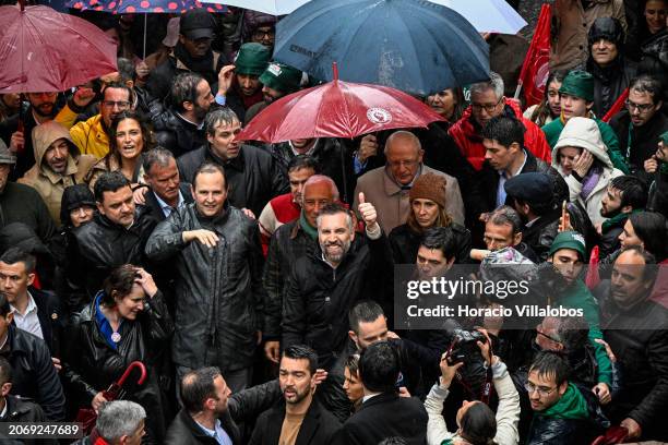 Socialist Party Secretary-General and candidate for Prime Minister Pedro Nuno Santos gives a thumbs-up while walking accompanied by Portuguese PM...