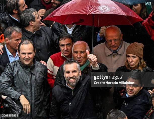 Socialist Party Secretary-General and candidate for Prime Minister Pedro Nuno Santos gives a thumbs-up while walking accompanied by Portuguese PM...