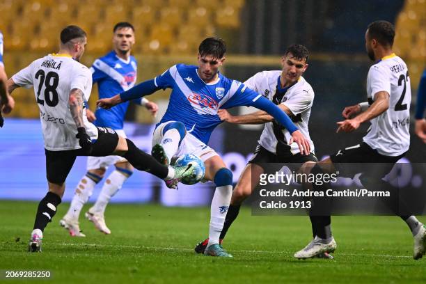Valentin Mihaila tackles during Serie B match between Parma and Brescia at Stadio Ennio Tardini on March 08, 2024 in Parma, Italy.
