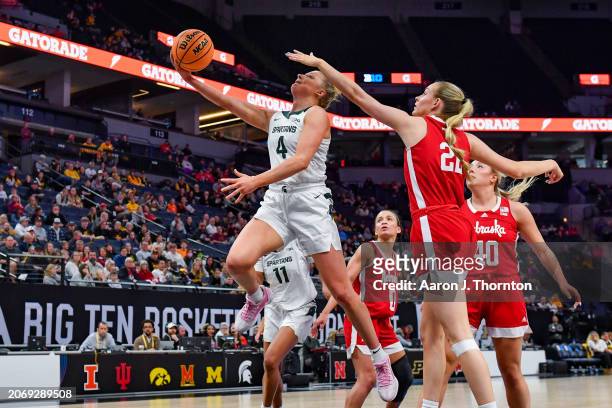 Theryn Hallock of the Michigan State Spartans attempts a shot against Natalie Potts of the Nebraska Cornhuskers during the first half of a Big Ten...