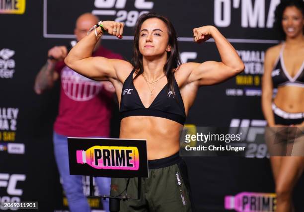 Maycee Barber poses on the scale during the UFC 299 ceremonial weigh-in at Kaseya Center on March 08, 2024 in Miami, Florida.