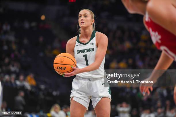 Tory Ozment of the Michigan State Spartans shoots a free throw during the first half of a Big Ten Women's Basketball Tournament quarter finals game...