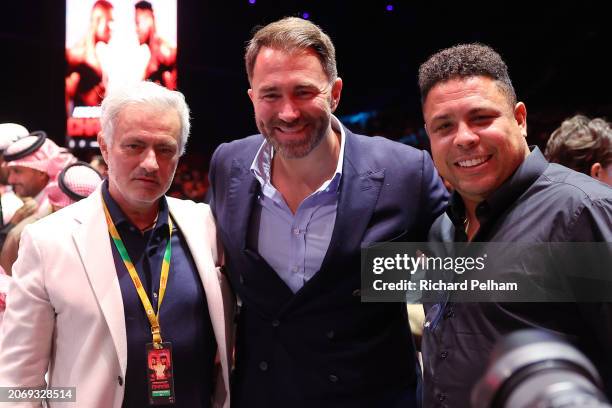 Jose Mourinho, Portuguese football manager, Eddie Hearn, Chairman of Matchroom Sport and Ronaldo, former Brazilian football player, pose for a photo...