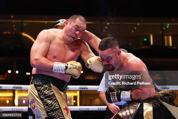 Zhilei Zhang and Joseph Parker exchange punches during the WBO Interim World Heavyweight title fight between Zhilei Zhang and Joseph Parker on the...