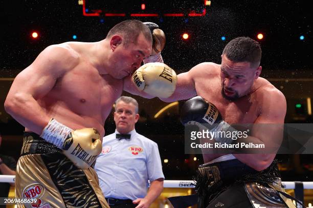 Zhilei Zhang and Joseph Parker exchange punches during the WBO Interim World Heavyweight title fight between Zhilei Zhang and Joseph Parker on the...