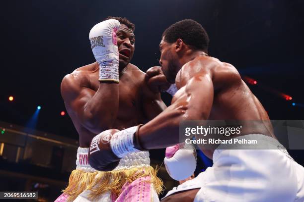 Francis Ngannou and Anthony Joshua exchange punches during the Heavyweight fight between Anthony Joshua and Francis Ngannou on the Knockout Chaos...