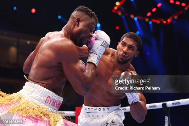 Anthony Joshua punches Francis Ngannou during the Heavyweight fight between Anthony Joshua and Francis Ngannou on the Knockout Chaos boxing card at...