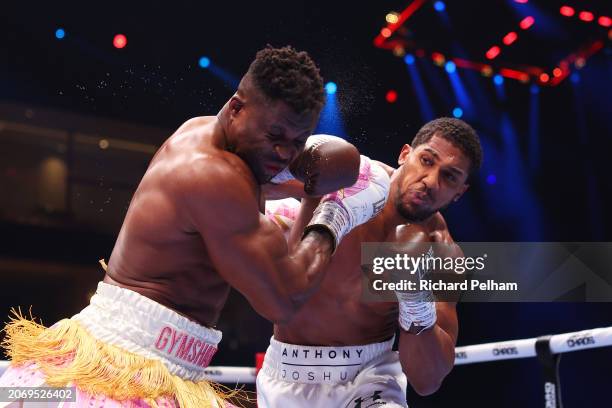 Anthony Joshua punches Francis Ngannou during the Heavyweight fight between Anthony Joshua and Francis Ngannou on the Knockout Chaos boxing card at...