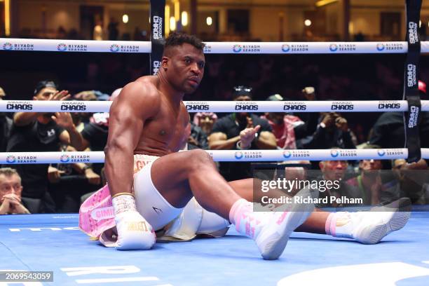 Francis Ngannou reacts after being knocked down by Anthony Joshua during the Heavyweight fight between Anthony Joshua and Francis Ngannou on the...