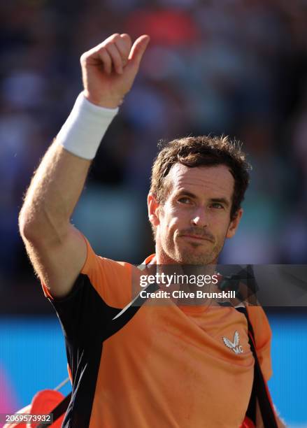 Andy Murray of Great Britain walks off court dejected after his straight sets defeat against against Andrey Rublev in their second round match during...