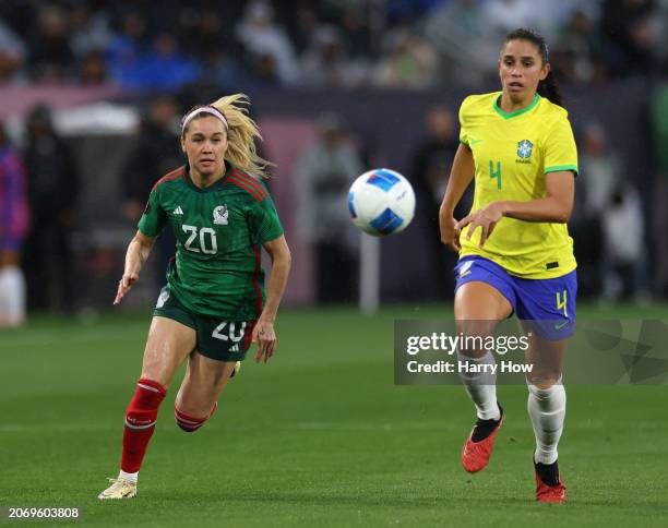 Rafaelle of Brazil and Mayra Pelayo of Mexico run down a ball in a 3-0 Brazil win during the Semifinals 2024 Concacaf W Gold Cup at Snapdragon...