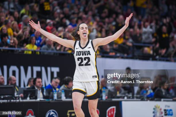 Caitlin Clark of the Iowa Hawkeyes reacts after making a 3-pointer to break the NCAA single season 3-point record for any gender during the second...