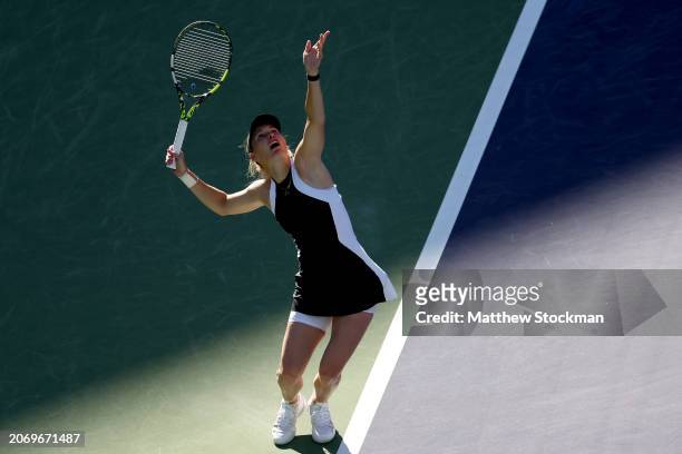 Caroline Wozniacki of Denmark serves to Donna Vekic of Croatia during the BNP Paribas Open at Indian Wells Tennis Garden on March 08, 2024 in Indian...