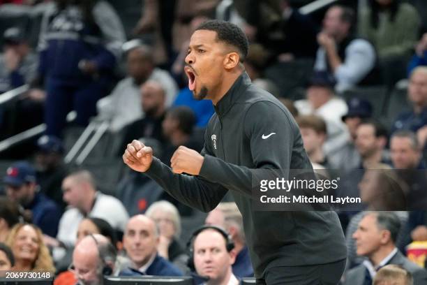 Head coach KIm English of the Providence Friars cheers his players during a college basketball game against the Georgetown Hoyas at the Capital One...