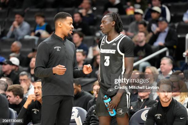 Head coach KIm English of the Providence Friars talks with Gary Dual during a college basketball game against the Georgetown Hoyas at the Capital One...