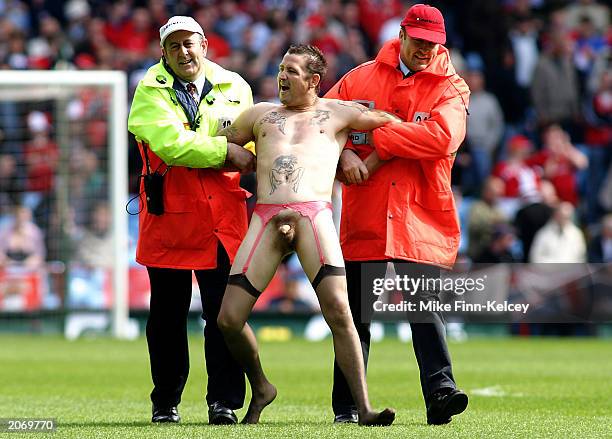 Streaker is removed from the pitch by stewards during the FA Trophy Final match between Burscough and Tamworth held on May 18, 2003 at Villa Park, in...