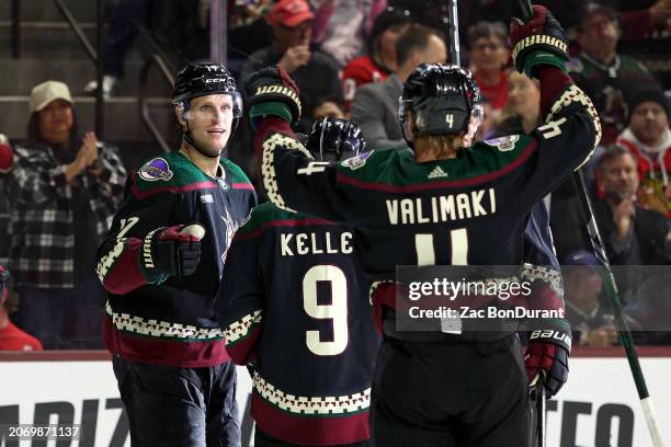 Nick Bjugstad of the Arizona Coyotes celebrates a goal against the Detroit Red Wings for his 300th career point during the second period with Clayton...