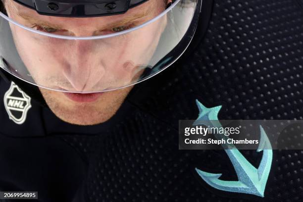 Jared McCann of the Seattle Kraken takes a faceoff against the Winnipeg Jets during the second period at Climate Pledge Arena on March 08, 2024 in...