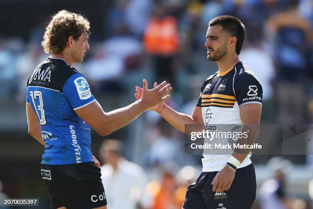 Tom Wright of the Brumbies and Bayley Kuenzle of the Western Force shake hands at the end of the round three Super Rugby Pacific match between ACT...