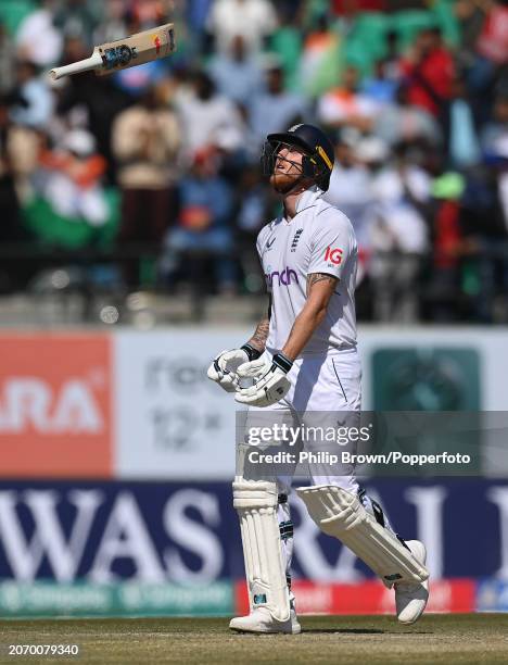 Ben Stokes of England throws his bat in the air after being dismissed by Ravichandran Ashwin during day three of the 5th Test Match between India and...