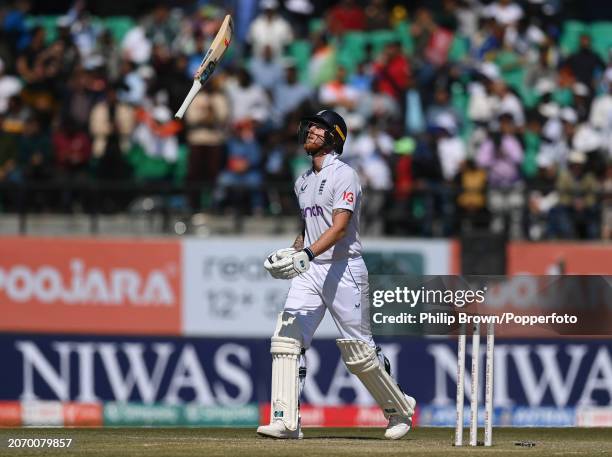 Ben Stokes of England throws his bat in the air after being dismissed by Ravichandran Ashwin during day three of the 5th Test Match between India and...