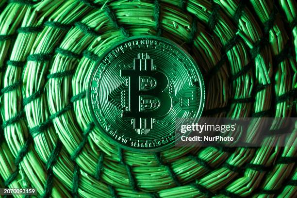 Bitcoins golden physical coin illustration on dark black background with reflection and vibrant color light illumination. Visual representations of...