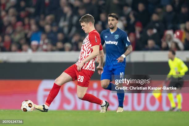 Matthias Ginter of SC Freiburg plays the ball during the UEFA Europa League 2023/24 round of 16 first leg match between Sport-Club Freiburg and West...