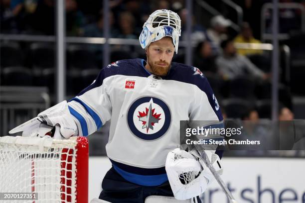 Laurent Brossoit of the Winnipeg Jets looks on during the second period against the Seattle Kraken at Climate Pledge Arena on March 08, 2024 in...