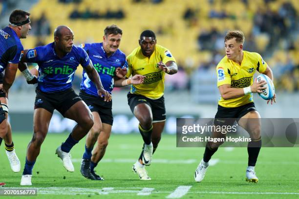 Ruben Love of the Hurricanes makes a break during the round three Super Rugby Pacific match between Hurricanes and Blues at Sky Stadium, on March 09...