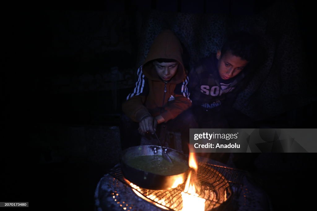 Sahur meal of Ramadan in a shelter on Gaza as Israeli attacks continue
