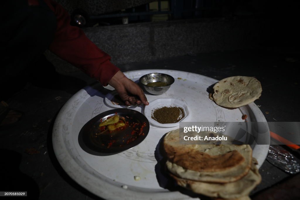 Sahur meal of Ramadan in a shelter on Gaza as Israeli attacks continue