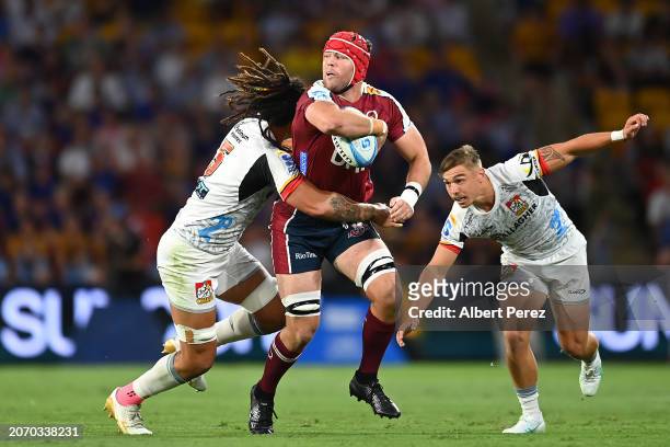 Harry Wilson of the Reds is tackled during the round three Super Rugby Pacific match between Queensland Reds and Chiefs at Suncorp Stadium, on March...