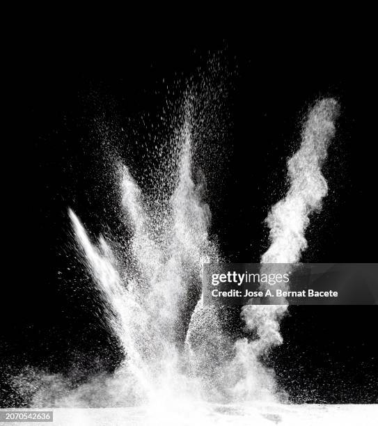 multiple explosions of smoke and dust in upward motion on a black background. - detonator stock pictures, royalty-free photos & images