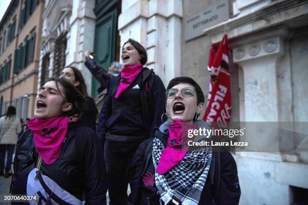 Woman takes part in a protest wearing a Palestinian keffiyeh in front of the University Rectorate during the International Women's Day March...