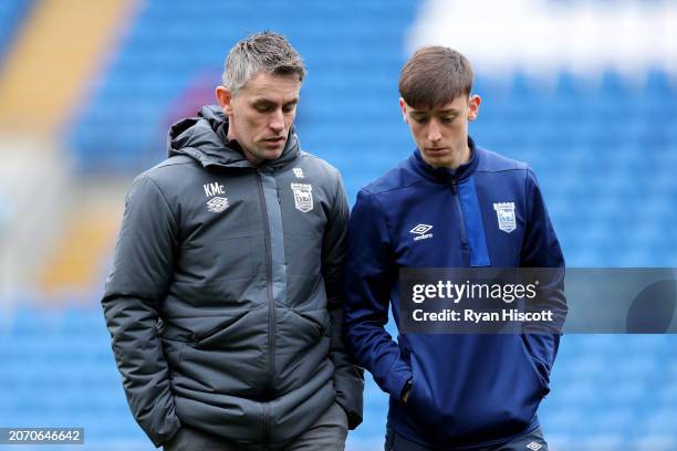 Kieran McKenna, Manager of Ipswich Town, interacts with Cameron Humphreys of Ipswich Town during the Sky Bet Championship match between Cardiff City...