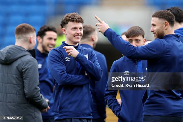 Nathan Broadhead of Ipswich Town interacts with teammates during a pitch inspection prior to the Sky Bet Championship match between Cardiff City and...
