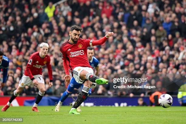 Bruno Fernandes of Manchester United scores his team's first goal from the penalty spot during the Premier League match between Manchester United and...