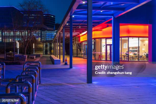 pedestrian passage inside the business district at dusk - company town hall stock pictures, royalty-free photos & images