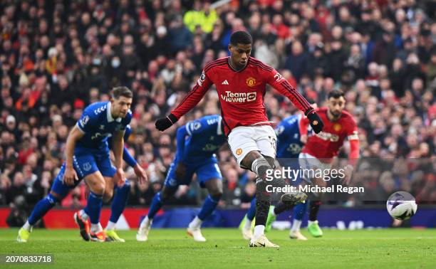 Marcus Rashford of Manchester United scores his team's second goal from the penalty spot during the Premier League match between Manchester United...
