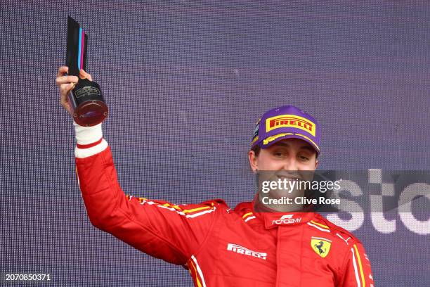 Third placed Maya Weug of Netherlands and PREMA Racing celebrates on the podium during Round 1 Jeddah race 2 of the F1 Academy at Jeddah Corniche...