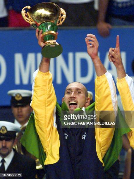 Brazilian captain Nalbert raises the trophy after the Brazil - Russia final match at the Men's Volleyball World Championship played at the Luna Park...