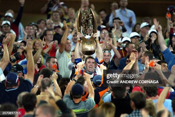 Sydney City Rooster and captain, Brad Fittler , holds aloft the Telstra Cup and celebrates winning the National Rugby League Grand Final, 06 October...